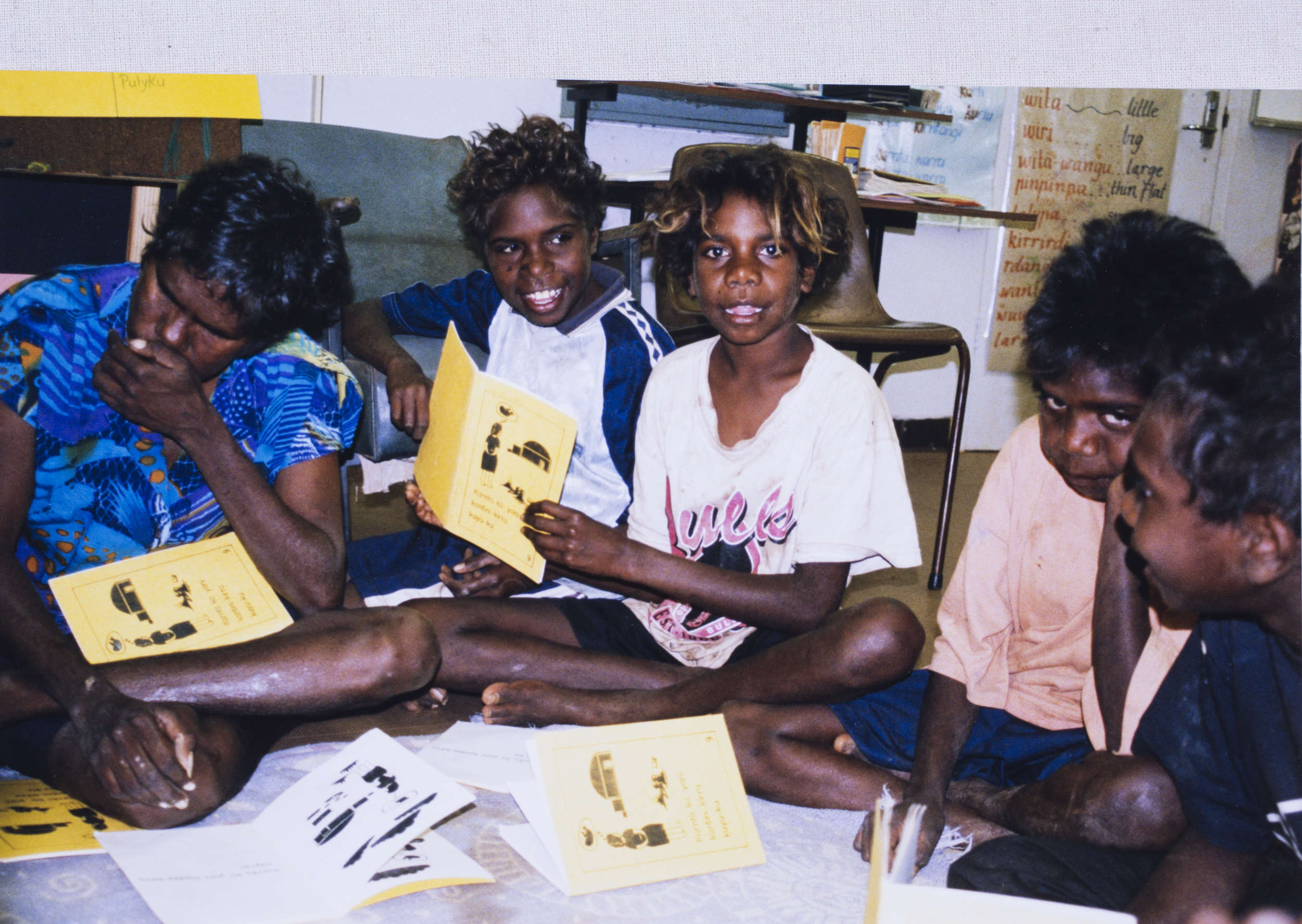 Children sitting on floor reading